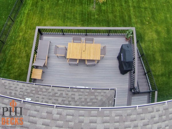 Gray-decking-cocktail-railing-gate-capped-composite-decking