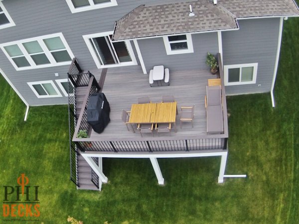 Low-maintenance-timbertech-decking-cocktail-railing-wrapped-posts