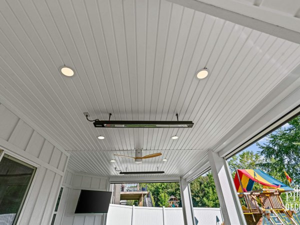 Covered patio ceiling beneath The Oakview Deck with recessed lighting, ceiling fan, and InfraTech heaters.