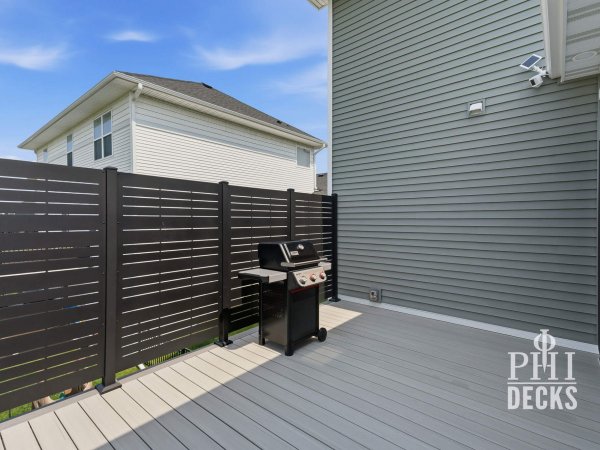Horizon privacy panels create a dedicated grilling area on the attached deck.