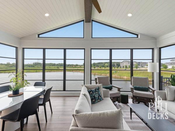 Pondview Porch interior with black Xtend windows overlooking the pond in Rogers, Minnesota.