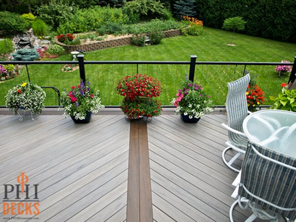 capped-composite-decking-hidden-fasteners-vertical-cable-railing