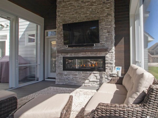 outdoor_stone_fireplace_fireplace_in_porch