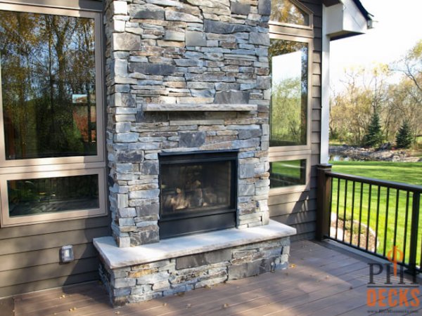 stone-fireplace-indoor-outdoor-fireplace-porch-custom-deck-PHI-Decks